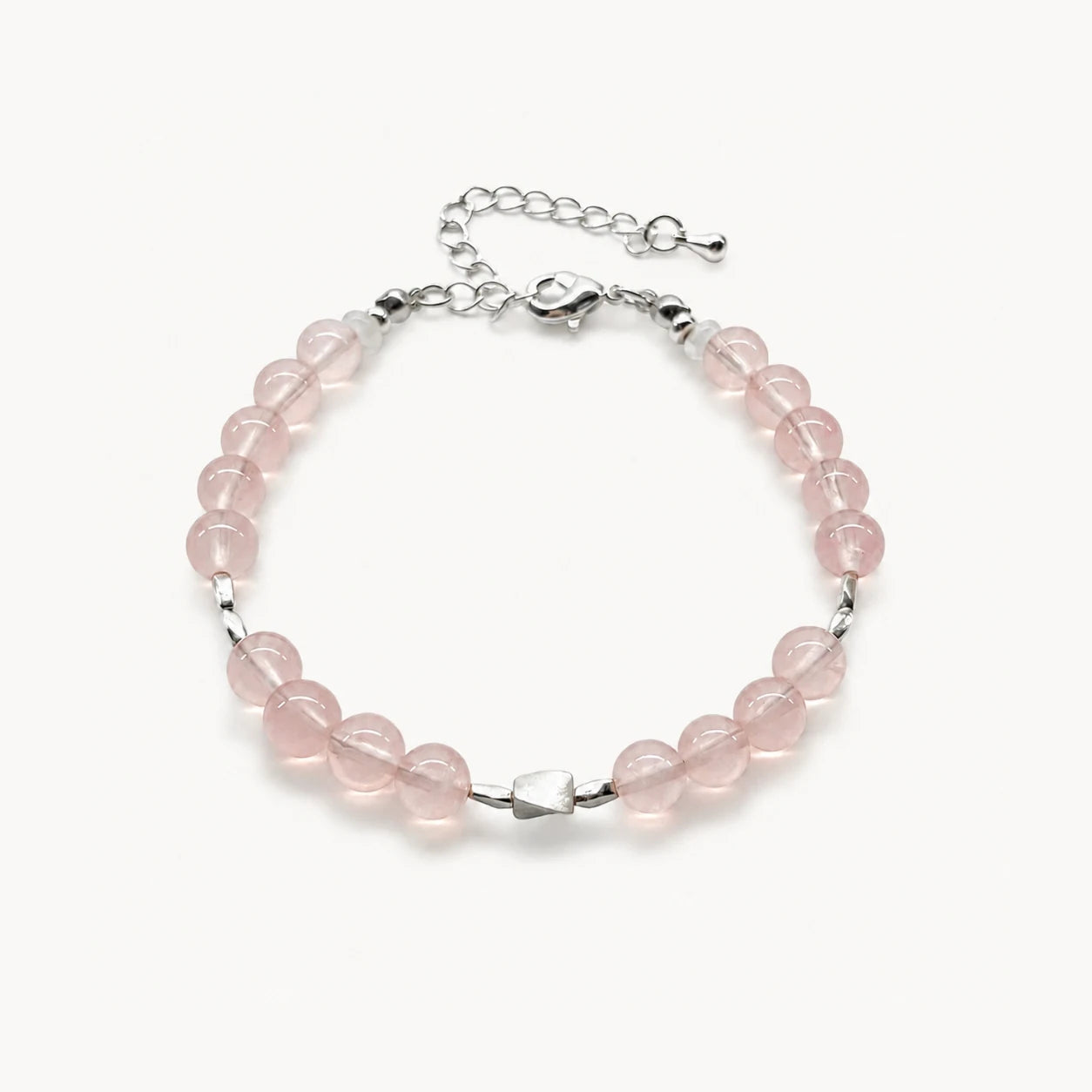 First Blush Poise Bracelet with rose quartz, white quartz rondelles, and 925 sterling silver accents on a white background