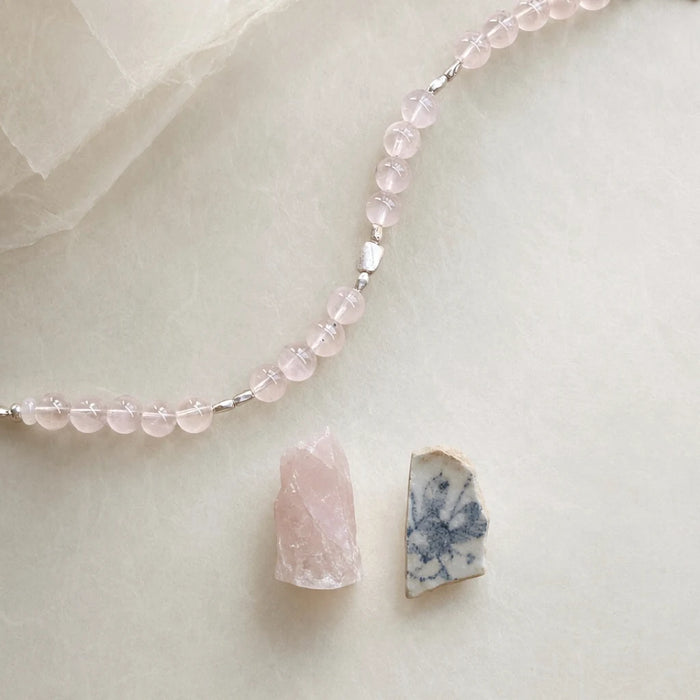 Close-up of the First Blush Poise Bracelet showing 6 mm rose quartz, white quartz rondelles, and 925 sterling silver details