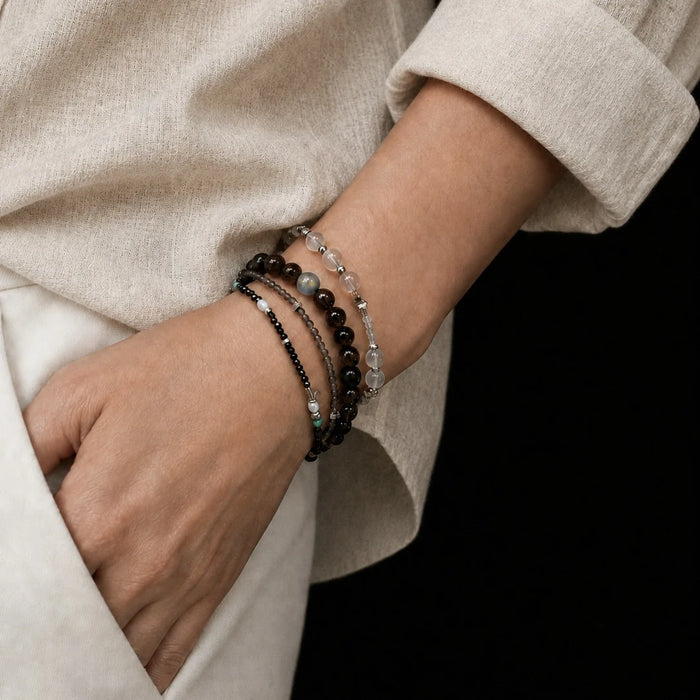 Strata Dusk Passage Bracelet worn on the wrist, showing its natural brown tones and contrasting turquoise details
