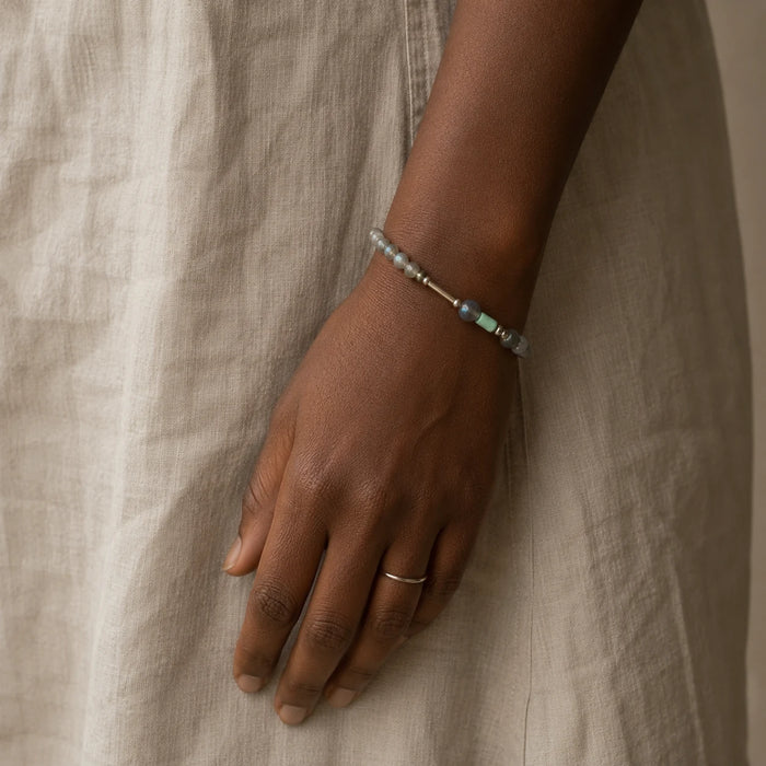 Veiled Light Blue Hour Bracelet worn alone on the wrist, showing its blue-grey moonstone and sterling silver composition