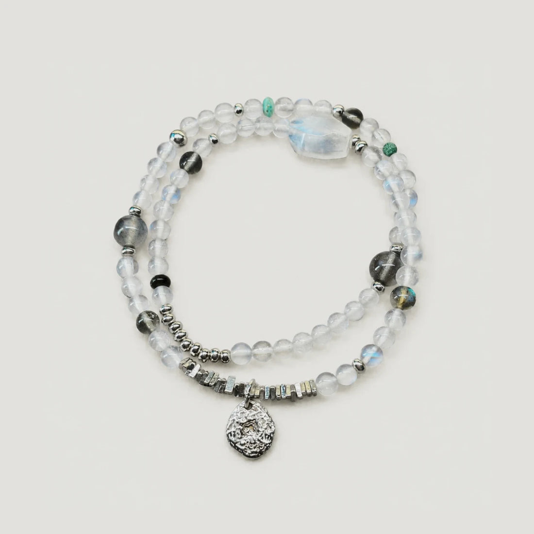 Veiled Light Echo Bracelet with blue and grey moonstone, obsidian, turquoise, and 925 sterling silver details