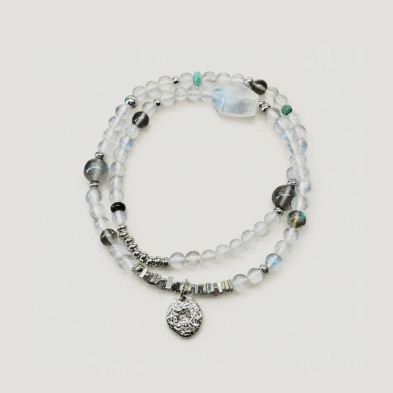 Veiled Light Echo Bracelet with blue and grey moonstone, obsidian, turquoise, and 925 sterling silver details