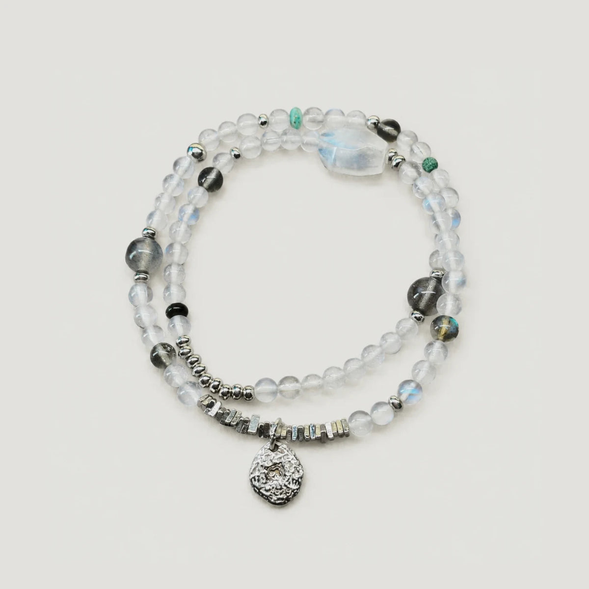 Veiled Light Echo Bracelet with blue and grey moonstone, obsidian, turquoise, and 925 sterling silver details