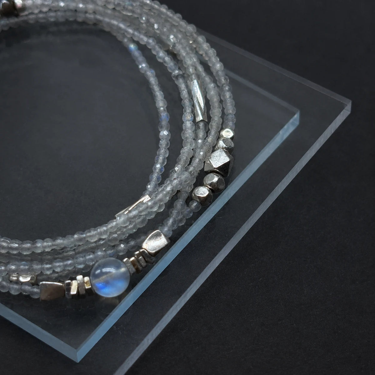 Close-up of the Veiled Light Moon Dust Bracelet with blue moonstone, grey moonstone, and 925 sterling silver details