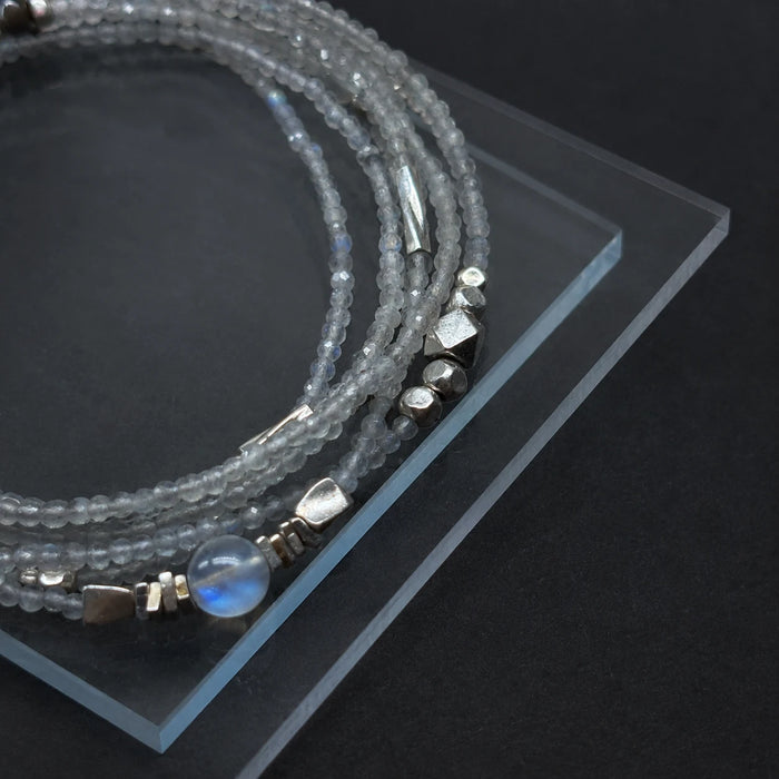 Close-up of the Veiled Light Moon Dust Bracelet with blue moonstone, grey moonstone, and 925 sterling silver details