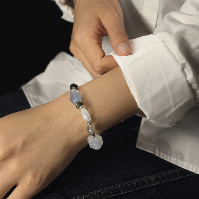 Veiled Light Prism Bracelet worn alone, showing its asymmetric moonstone, labradorite, and sterling silver design