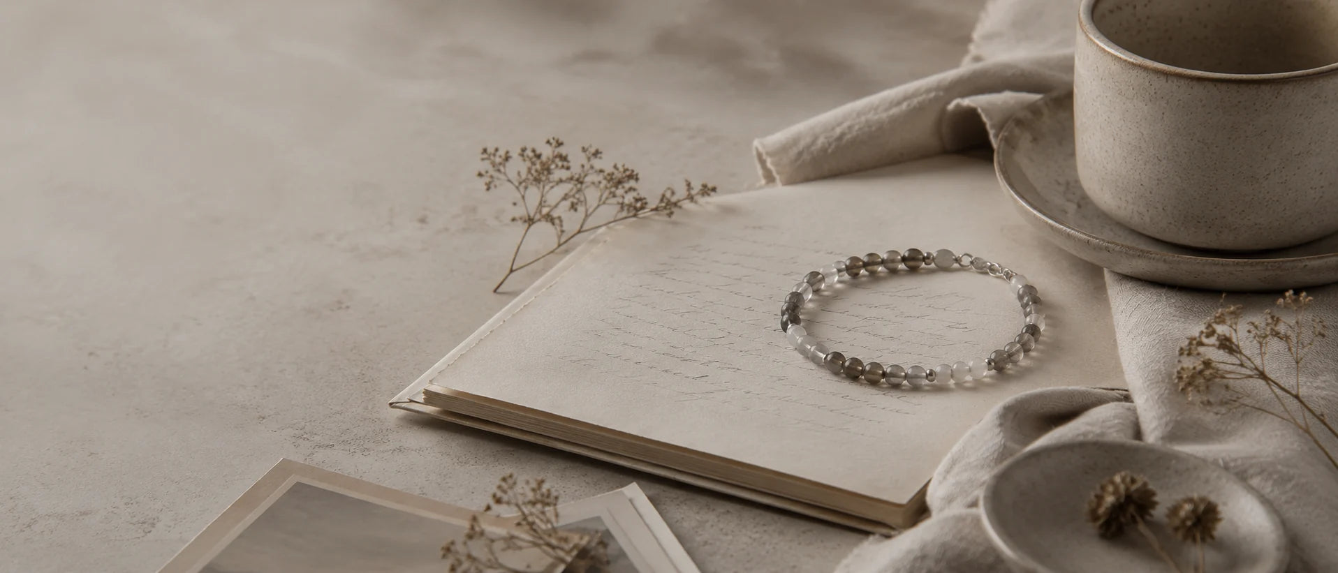Veil Loom Journal — crystal bracelet, handwritten pages, and quiet studio objects